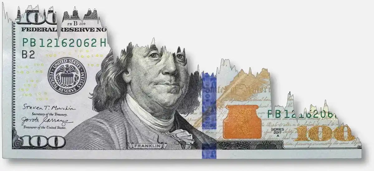 Partial view of a U.S. one hundred dollar bill showing the left portion with the portrait.